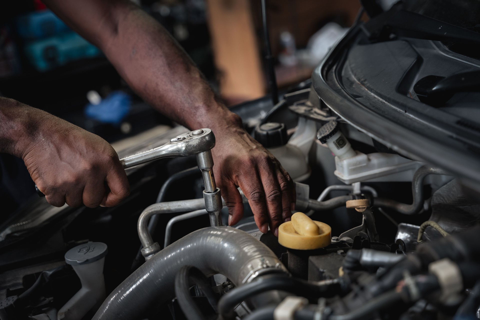 Car Machanic checking and maintenance on the car in the garage. Car repair and maintenanc concept.